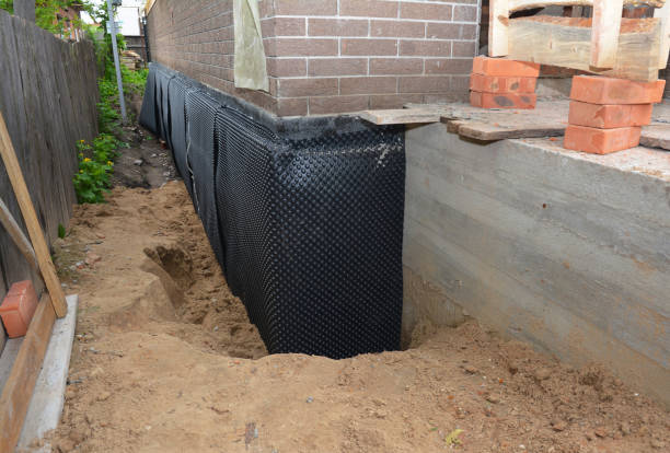 SJ Waterproofing Pros technician performing targeted Waterproofing assessment in Collins, OH